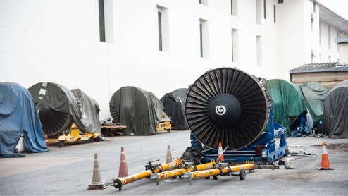 Image of several jet engines, awaiting installation.