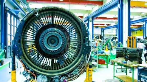 Image of a jet engine, disassembled for maintenance.